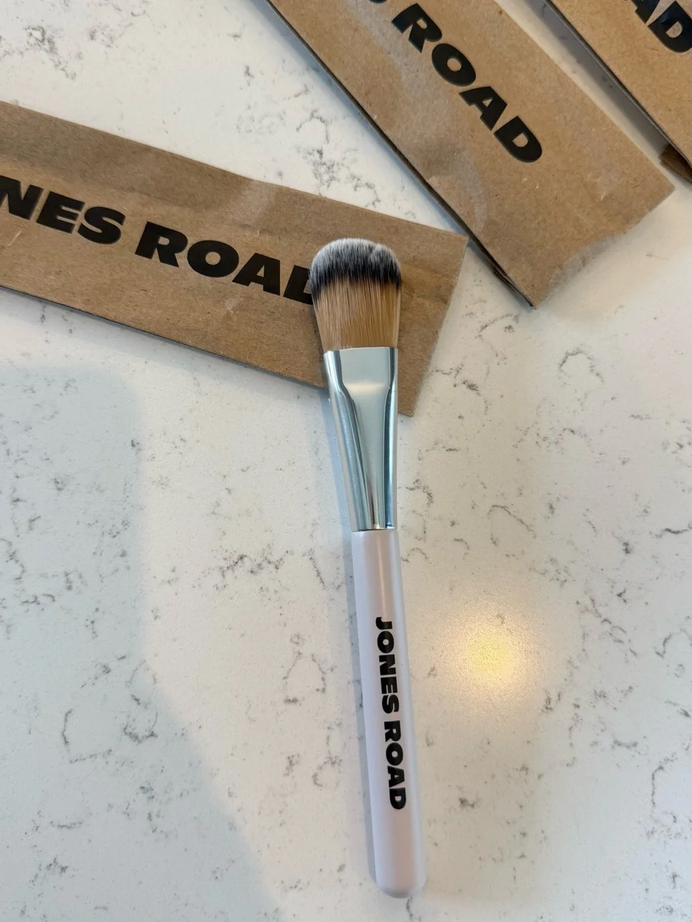Jones Road Skin Brush with Soft White Handle and Natural Bristles